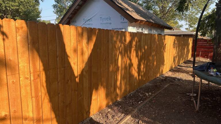 Finished cedar fence along the backyard