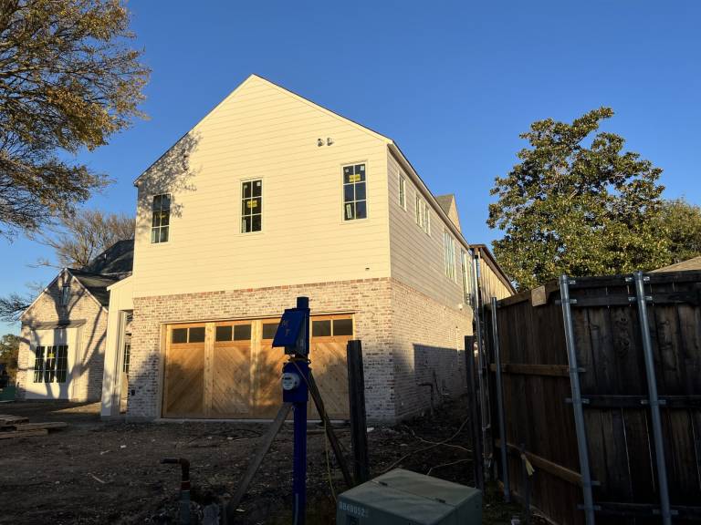 Side of a remodeled home with fresh exterior paint