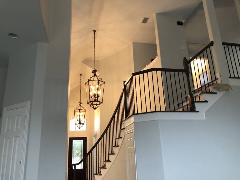Foyer and staircase railing with new paint