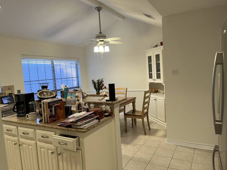White kitchen cabinets and breakfast area